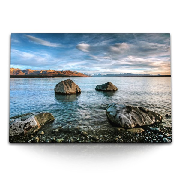 Paul Sinus Art 120x80cm Wandbild auf Leinwand Strand Felsen runde Steine Meer Horizont Berge