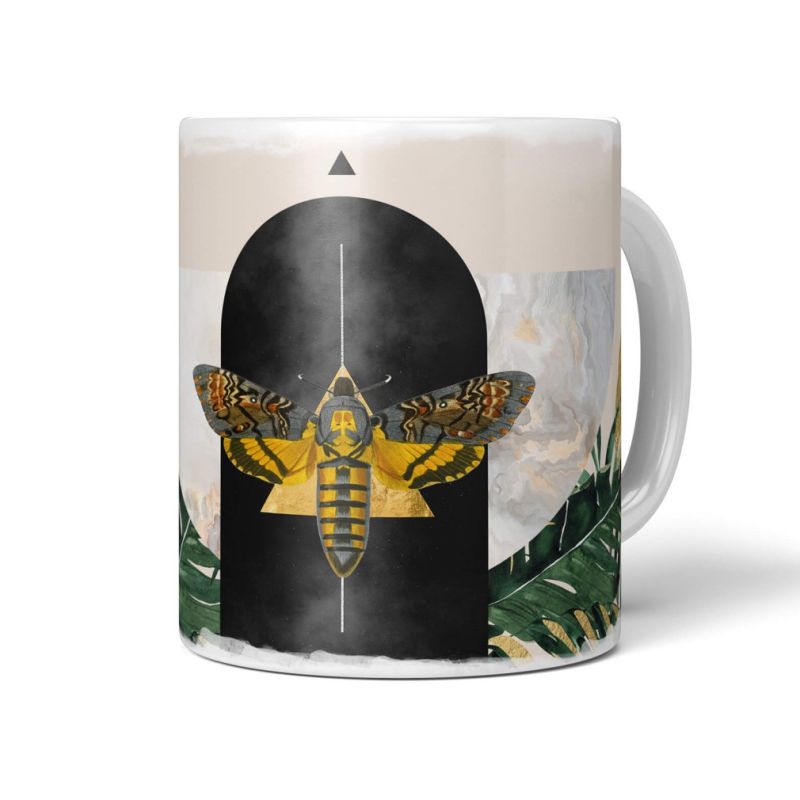 Dekorative Tasse mit schönem Motiv Motte Pflanzen Design goldene Elemente schwarzes Tor