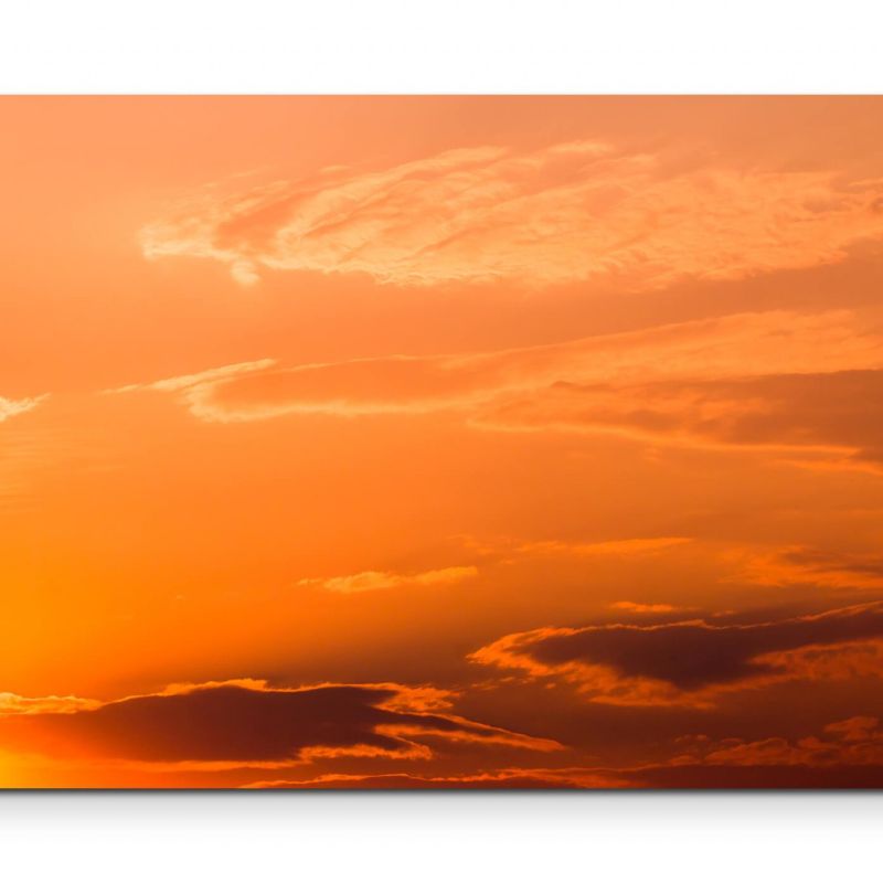 strahlender Himmel mit Wolken bei Sonnenuntergang – Leinwandbild